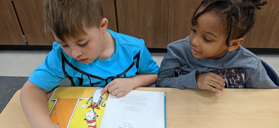 Students reading a Dr Suess Book