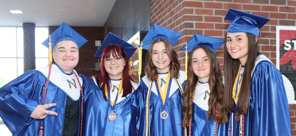 Graduation Day, five NWHS students in their caps and gowns 